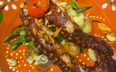 Caravela's octopus dish on Portuguese patterned crockery