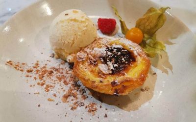 Portuguese custard tart served with ice cream at Caravela
